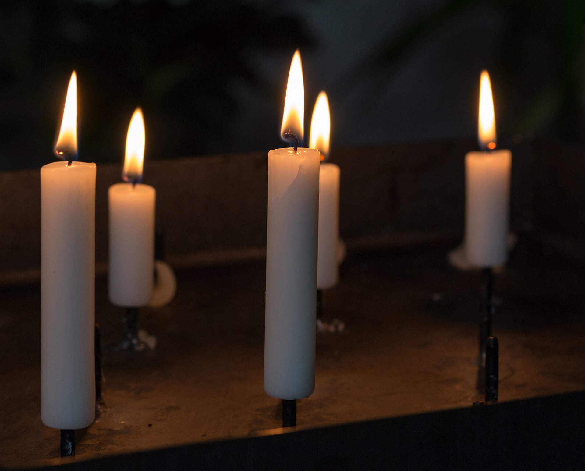 Candles in the St Jacob’s Church, Kirchspiel, Dülmen , North Rhine-Westphalia , Germany The church belongs to the former Marienburg Charterhouse – the only Carthusian monastery in Westphalia. The order came to Weddern in 1476/77 after the knight Gerd von Keppel donated his castle to the order. The charterhouse was inhabited until 1803. Construction of the church itself began in 1477, but remained unfinished for a long time; the keystone in the western bay bears the date 1607. After the monastery was dissolved, the building remained standing and is now used as a parish and community center. The church is a late Gothic place of worship built of red brick. The building has a deliberately simple design: a single-nave hall with a vaulted ceiling, choir area, and characteristic tracery windows. A tower with an octagonal pointed roof and dormers characterizes the exterior appearance. In 1871/72, the church was expanded in the neo-Gothic style, with a crypt for the von Croÿ family added and the interior expanded. Particularly noteworthy is the old choir stalls, which probably originate from Cologne and date from around 1350. Also impressive is a Rococo grille from 1752, which visually separates the altar area from the church and is artistically decorated.
