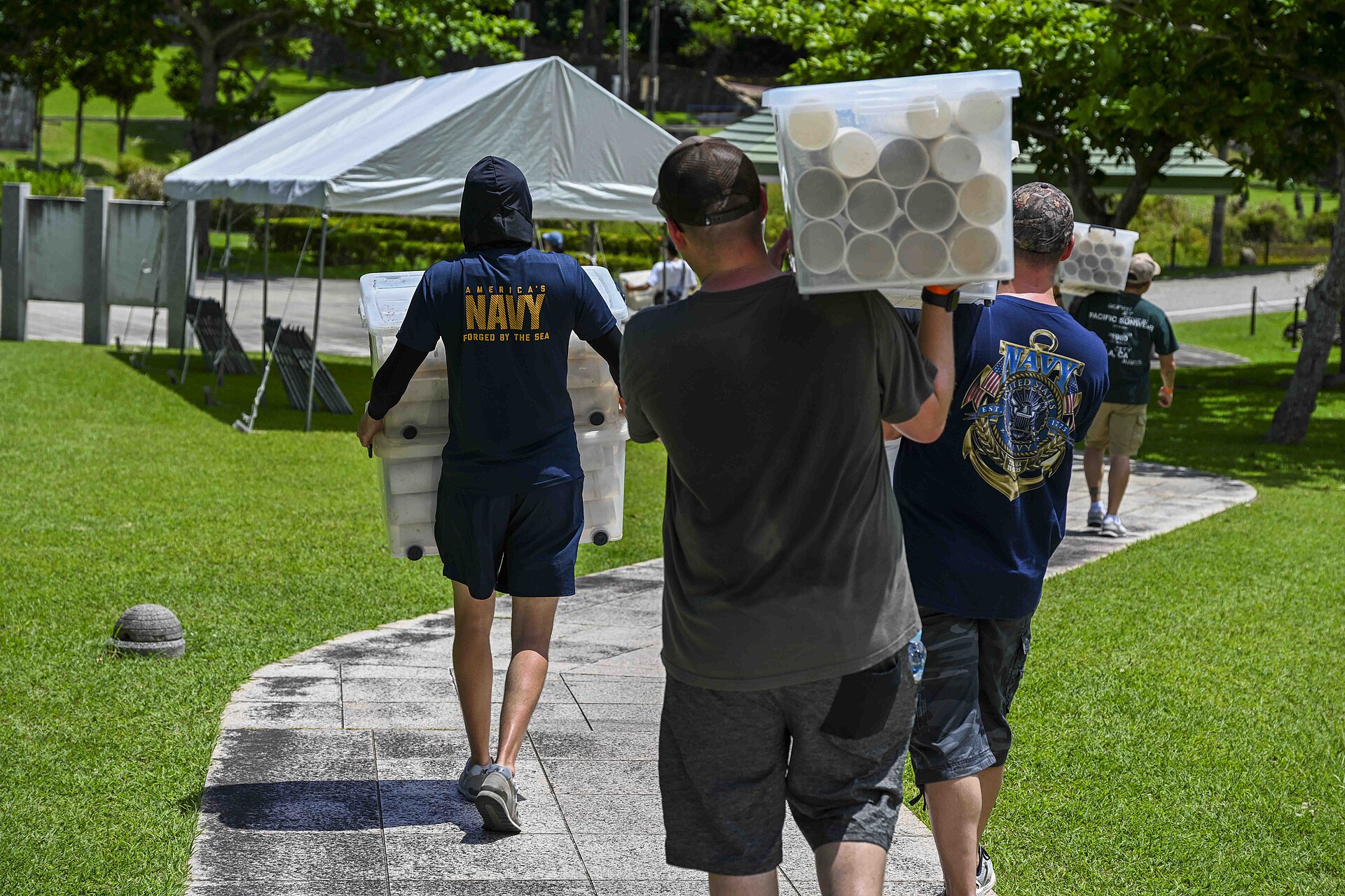 ITOMAN, Japan U.S. Navy Sailors stationed on Okinawa carry candleholders during a volunteer candle lighting event at Peace Memorial Park in Itoman, Okinawa, Japan, June 22, 2025. Held on the eve of Okinawa Memorial Day, the event marked the 80th anniversary of the 1945 Battle of Okinawa, honoring more than 200,000 lives lost and strengthening ties between the U.S. Navy and the local community. (U.S. Navy Photo by Mass Communication Specialist 1st Class MacAdam Kane Weissman)